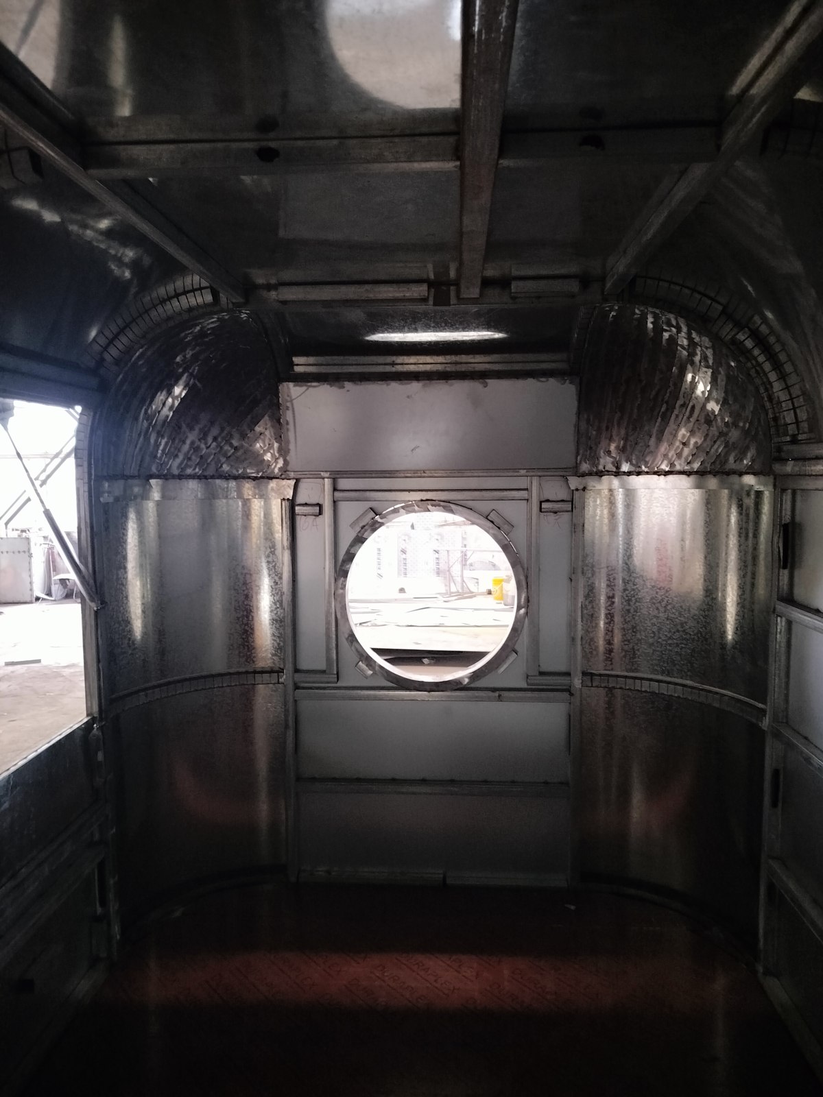 Interior before the lining was completed, with the round front window in place