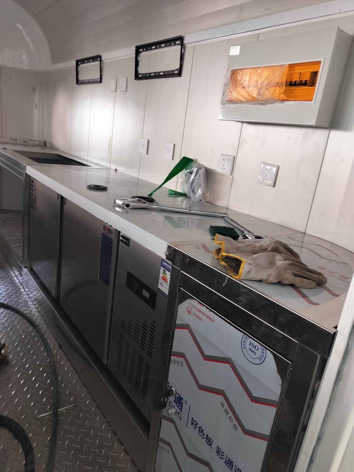 Stainless steel worktop and equipment being installed below it