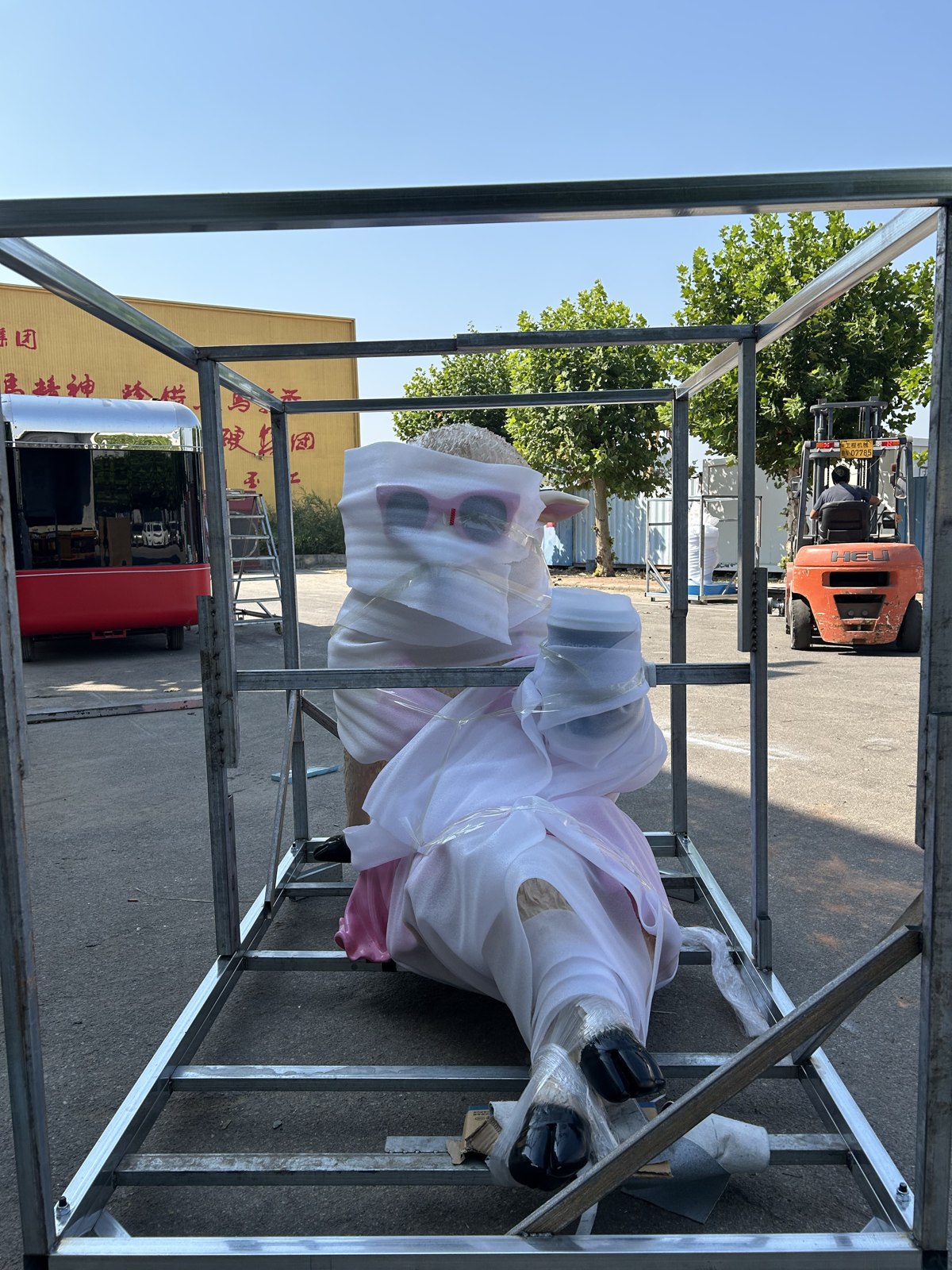 Wrapped sculpture inside its individual metal protection frame