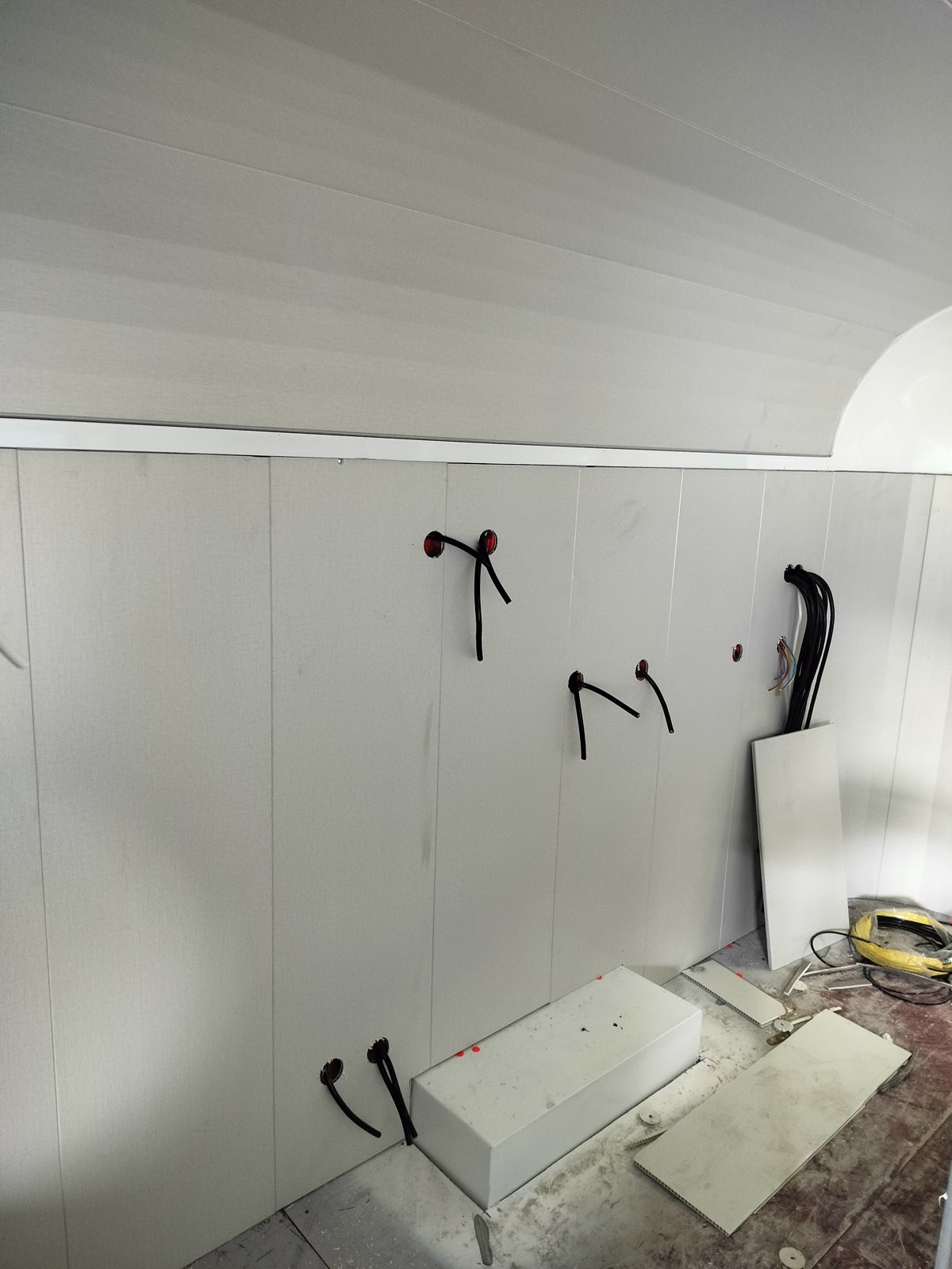 Cable outlet positions above the worktop area on the opposite wall