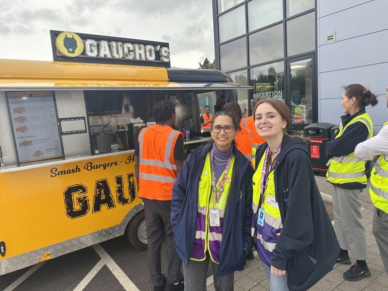 People gathered beside the Gaucho's burger trailer during service