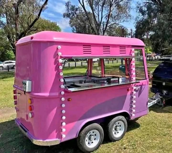 Rear view of the customer's pink ice cream trailer at an outdoor event