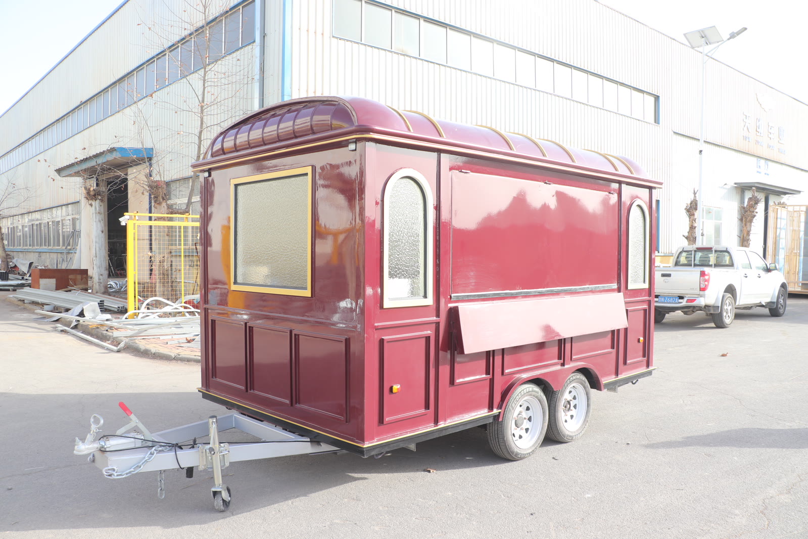 Rear three-quarter view of the completed food trailer during final inspection